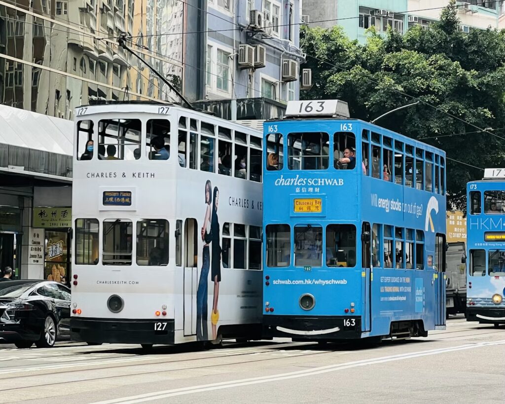 Double-decker trams on a street in Causeway Bay, Hong Kong