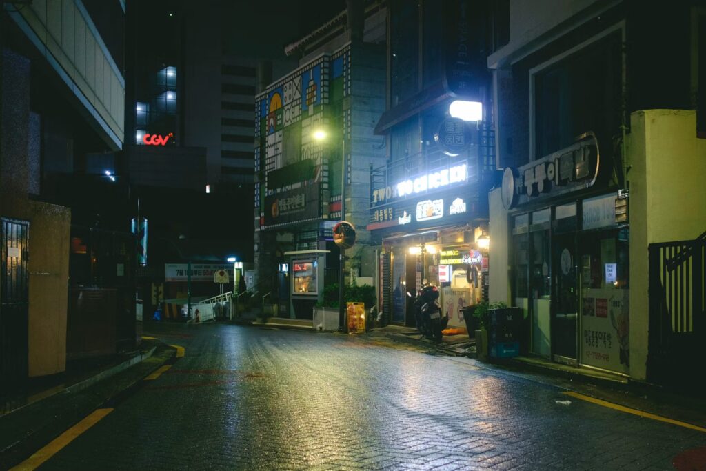 Visiting Seoul: Why the City Can Feel Overwhelming Before It Feels Interesting Quiet hanok alley with shop signs in Bukchon, Seoul, South Korea