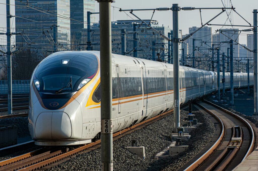 Getting Around China: How Transportation Planning Changes the Trip A sleek Fuxing high-speed train rounding a bend in China, transportation planning tips for your trip