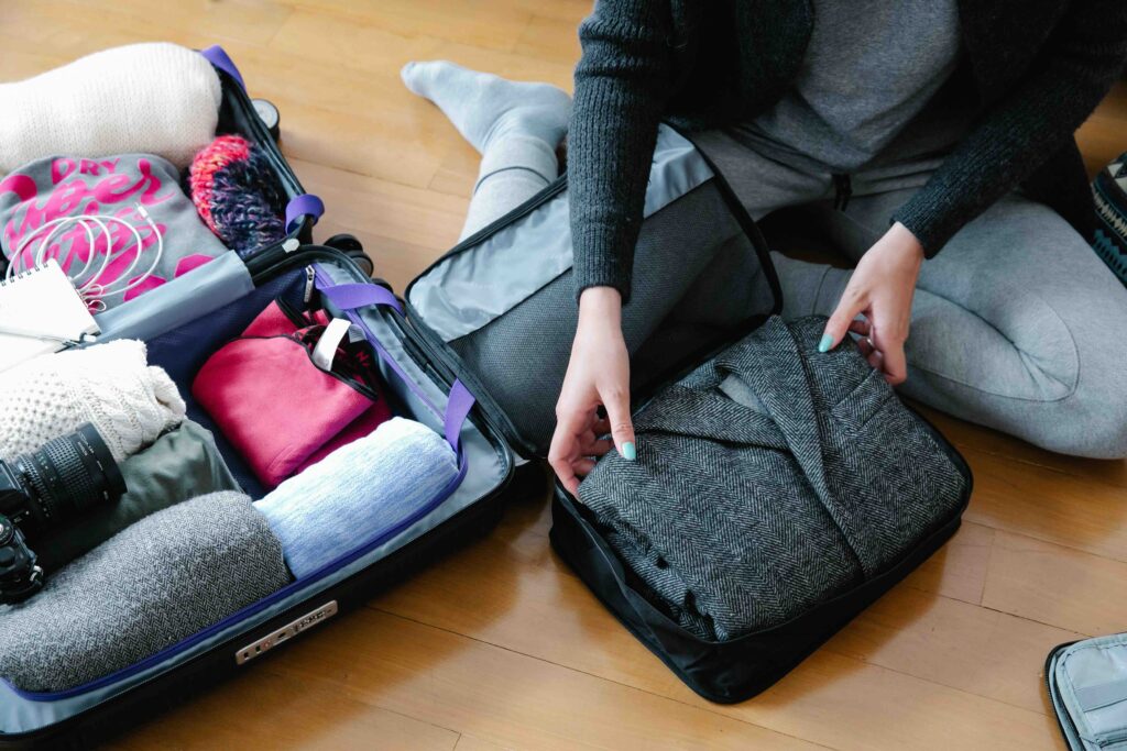 What to Pack for Korea: Weather Shifts and a Walking-Heavy Culture Neatly packed suitcase with folded clothes and packing cubes, what to pack for Korea travel guide