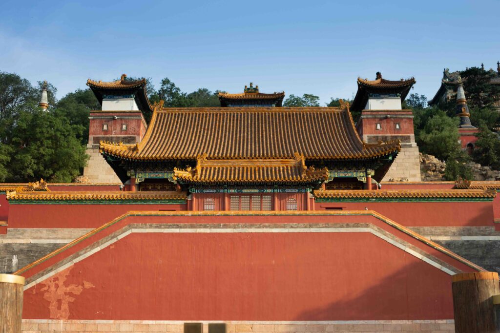 Traditional Chinese temple with golden tiled roofs and red walls, Beijing, China