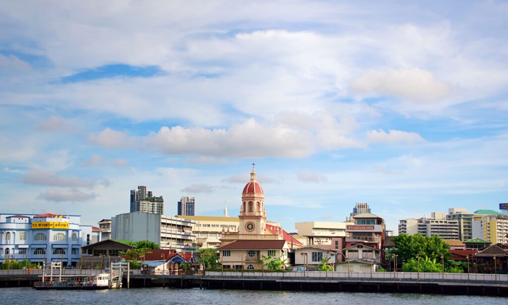 Where to Stay in Bangkok: Hotels That Manage Scale and Urban Intensity anta Cruz Church on the Chao Phraya River near riverside Bangkok hotels and stays.