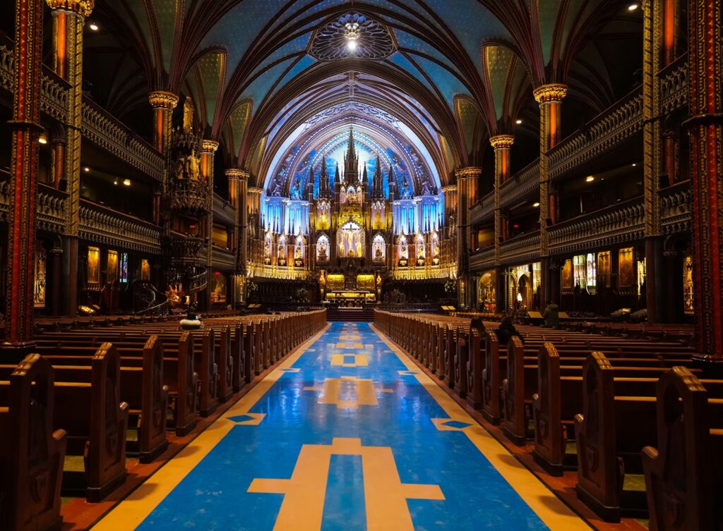 The Ultimate Guide to Montreal: Top Attractions, Hidden Gems, and Cultural Experiences Ornate blue and gold gothic interior of Notre-Dame Basilica in Montreal, a top attraction.