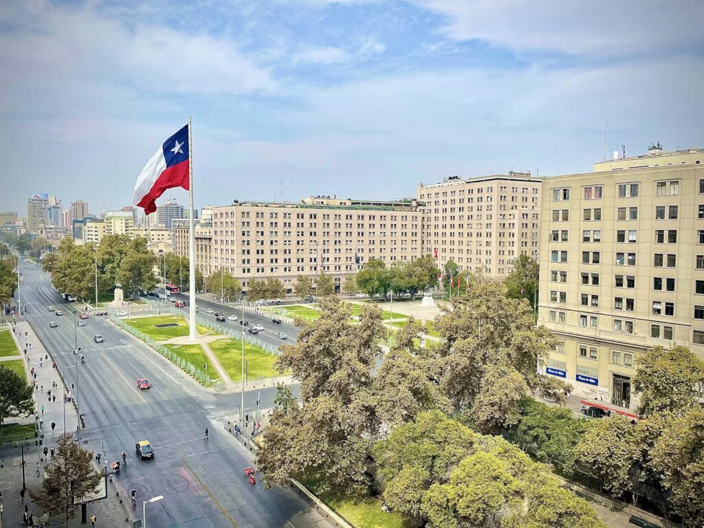 Santiago Chile Travel Guide: Best Things to Do, Must-See Sights, and Local Tips Chilean flag over a Santiago avenue, a travel guide to the best things to do and see.