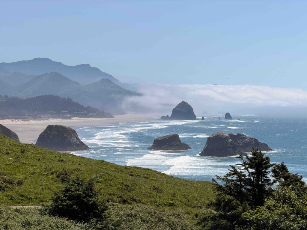 The Best Beaches in the U.S.: Top Coastal Destinations You Must Visit This Year Haystack Rock and sea stacks off Cannon Beach on the sunny Oregon coast, a top US beach.
