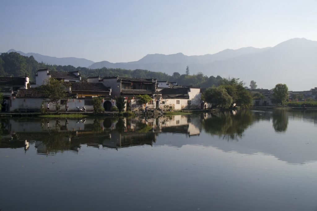 How to Plan a Cultural Experience in China: Top Temples, Markets, and Villages to Visit Traditional Huizhou houses reflected in the pond at Hongcun ancient village, Anhui, China