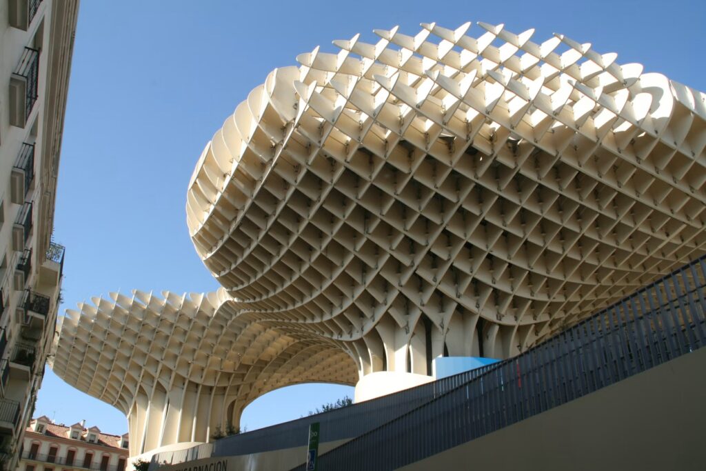 How to Plan Your First Trip to Spain: Essential Tips for First-Time Travelers and Beginners Curving wooden Metropol Parasol against blue sky in Seville, a first trip to Spain travel guide