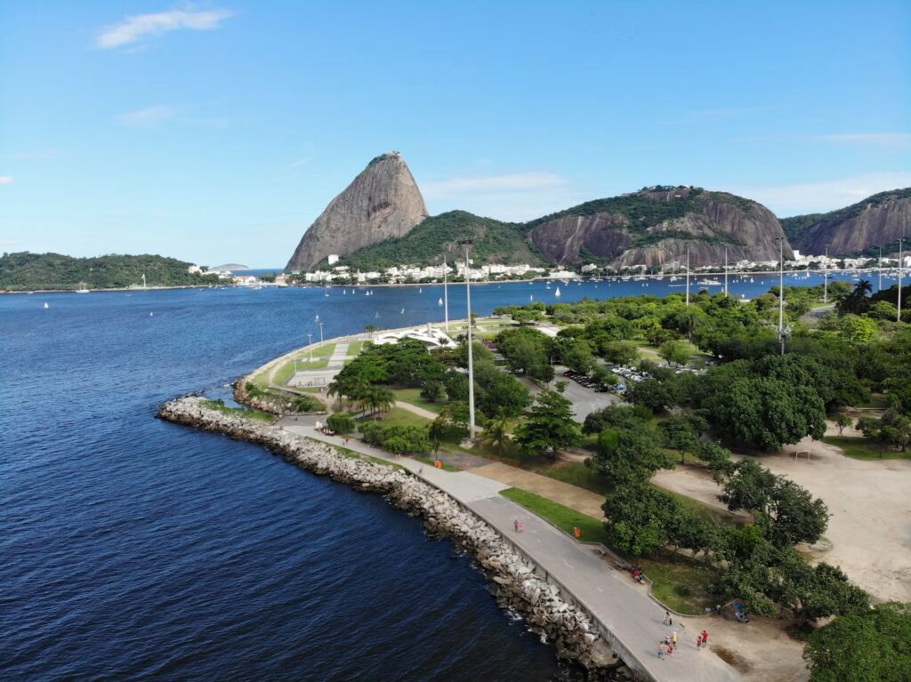 Sugarloaf Mountain over Botafogo Bay with sailboats under blue sky, Rio de Janeiro, Brazil
