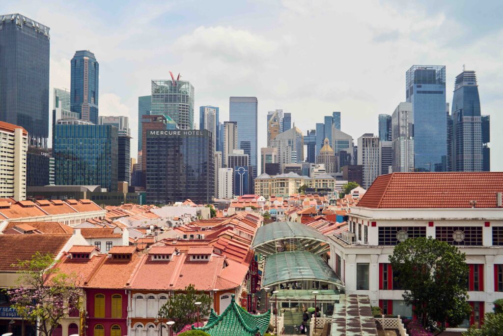 Where to Stay in Singapore: Modern Heritage Hotels That Offer Timeless Charm Heritage shophouses and modern skyline in Singapore, where to stay for timeless charm