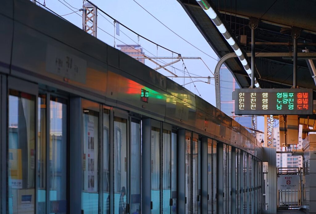 Essential Safety Tips for Traveling in South Korea: Stay Safe and Confident on Your Trip Train at a Seoul station with Korean signs, essential safety tips for South Korea