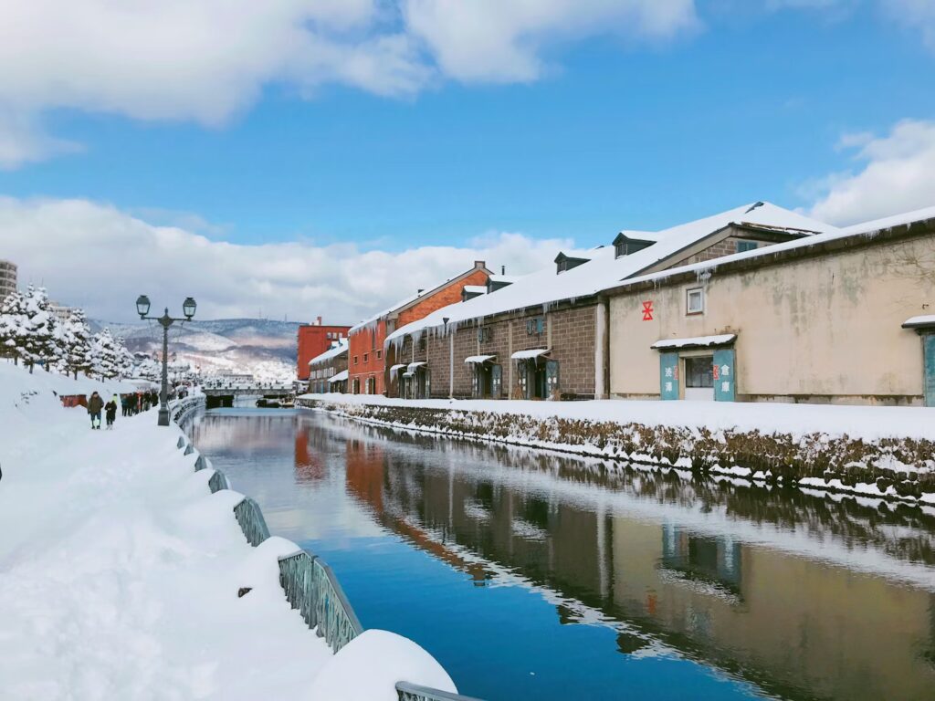12 Best Cities in Japan to Visit (2026): From Tokyo to Hidden Port Towns The historic Otaru Canal in winter, surrounded by snow-covered stone warehouses and mountains.