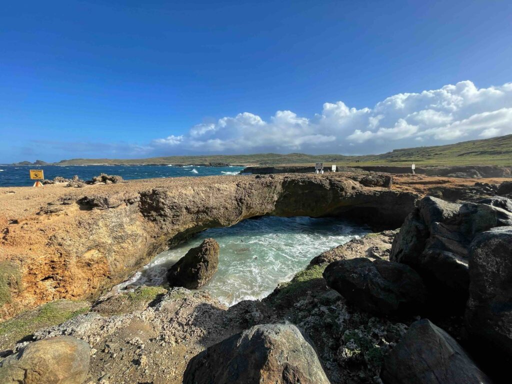 Natural stone bridge in Arikok National Park, Aruba, one of the best caribbean islands to visit 