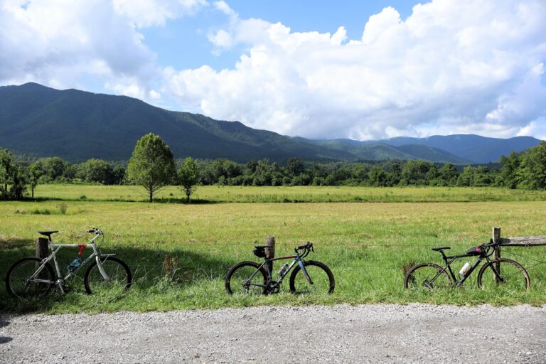 25 Best Places to Travel with Kids in the US: Stress-Free Escapes Bicycles parked along a peaceful country fence, ready for scenic outdoor kid-friendly activities