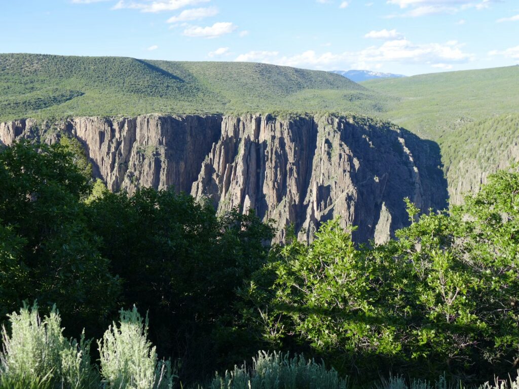 The steep, dark rock walls of the Black Canyon of the Gunnison. 