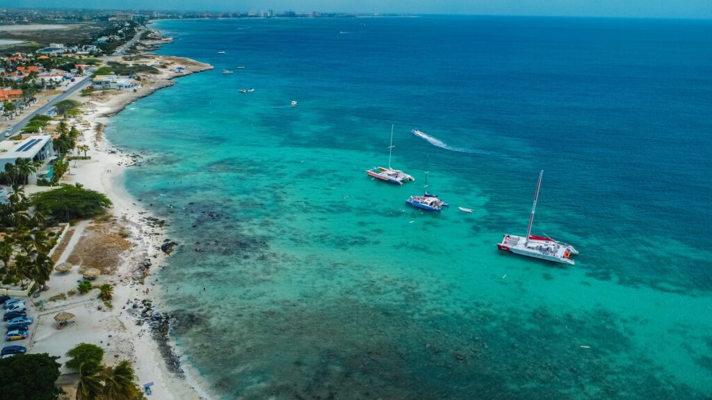 Aerial view of catamarans in turquoise waters, showcasing the best caribbean islands for families