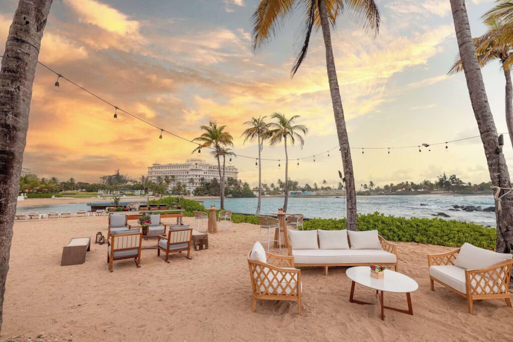 Lounge seating on Caribe Hilton's cove beach, ideal for puerto rico resorts for families 2026 