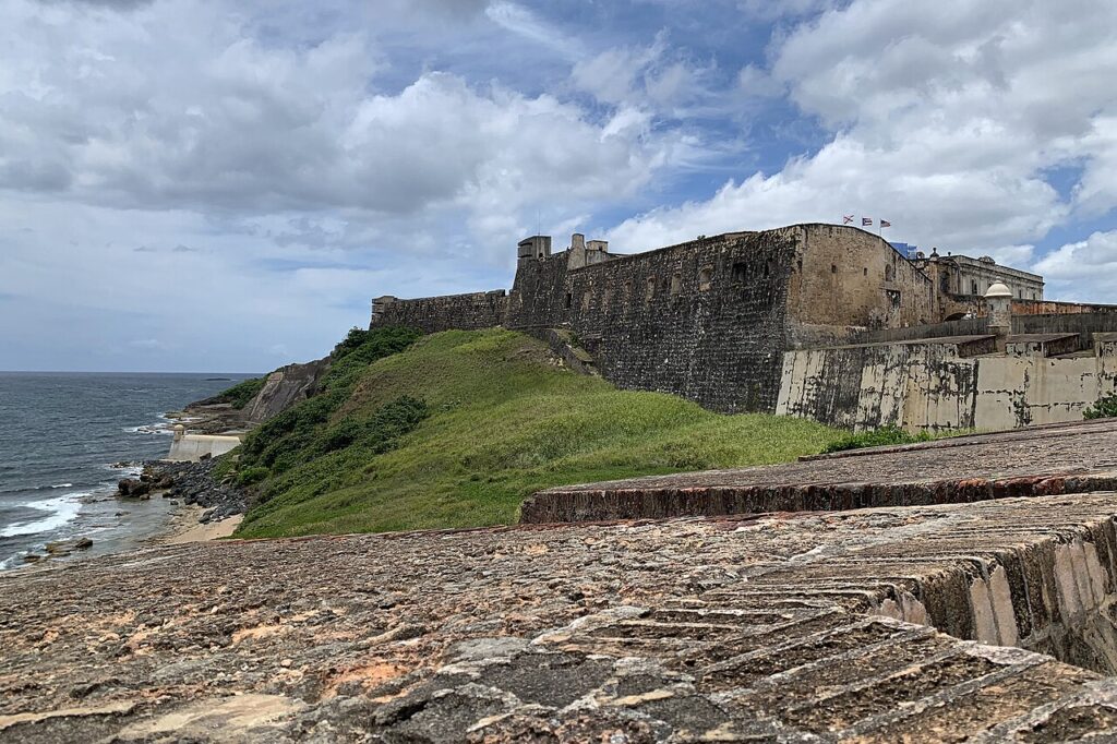 Castillo San Cristóbal fortress standing tall against a cloudy sky in Old San Juan. 
