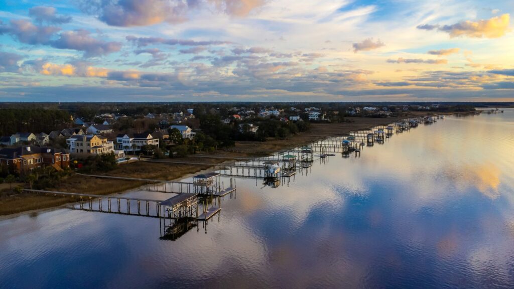 Peaceful waterfront with long wooden piers at sunset, showcasing why it's among the best family vacation spots