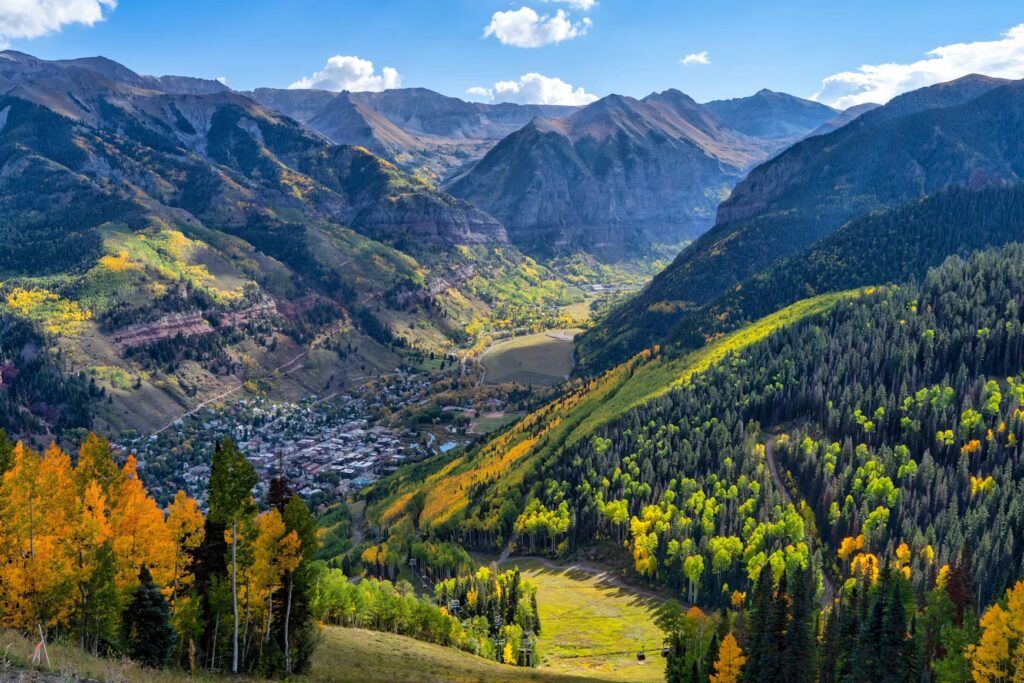 25 Best Places to Visit in Colorado: From the Rocky Mountains to Mesa Verde Mountain valley town in fall, one of the best places to visit in Colorado.