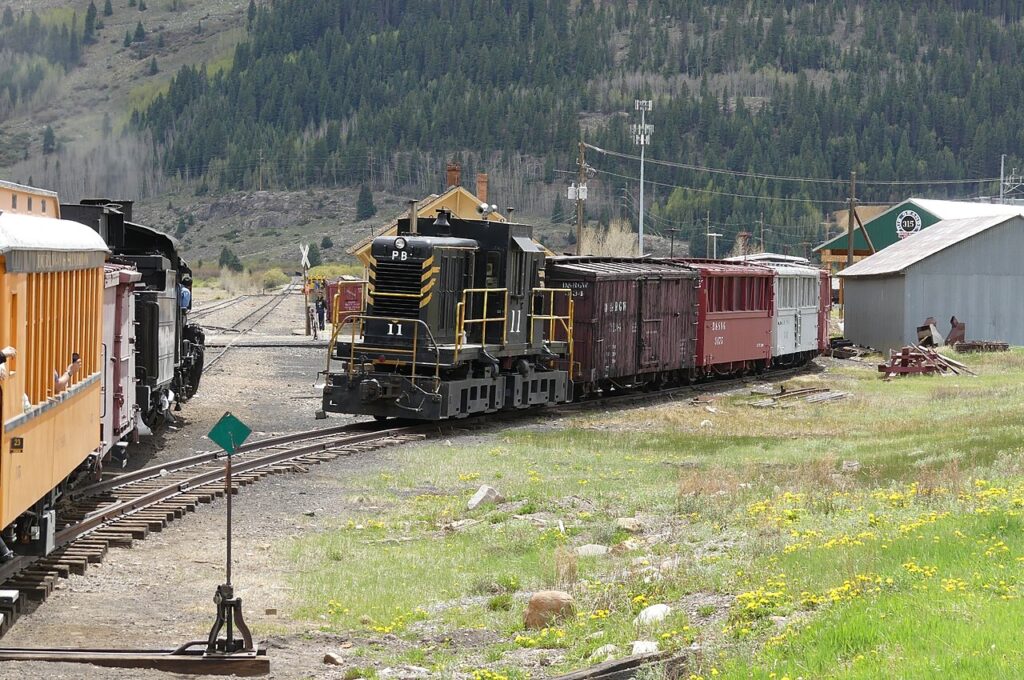 A black diesel locomotive operating at the railyard in Silverton. 