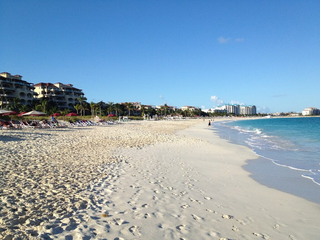 Aerial view of the Turks and Caicos coast with beach resorts, perfect for best caribbean resorts for families