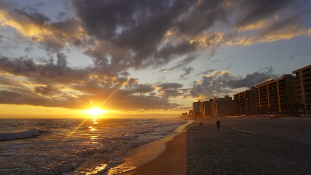 Sunset on Gulf Shores beach, Alabama, ideal for best family vacations on a budget