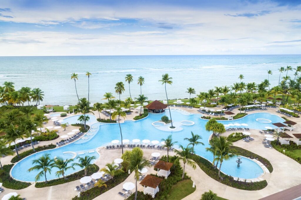 Expansive lagoon-style swimming pool and private beach at Hyatt Regency Grand Reserve 