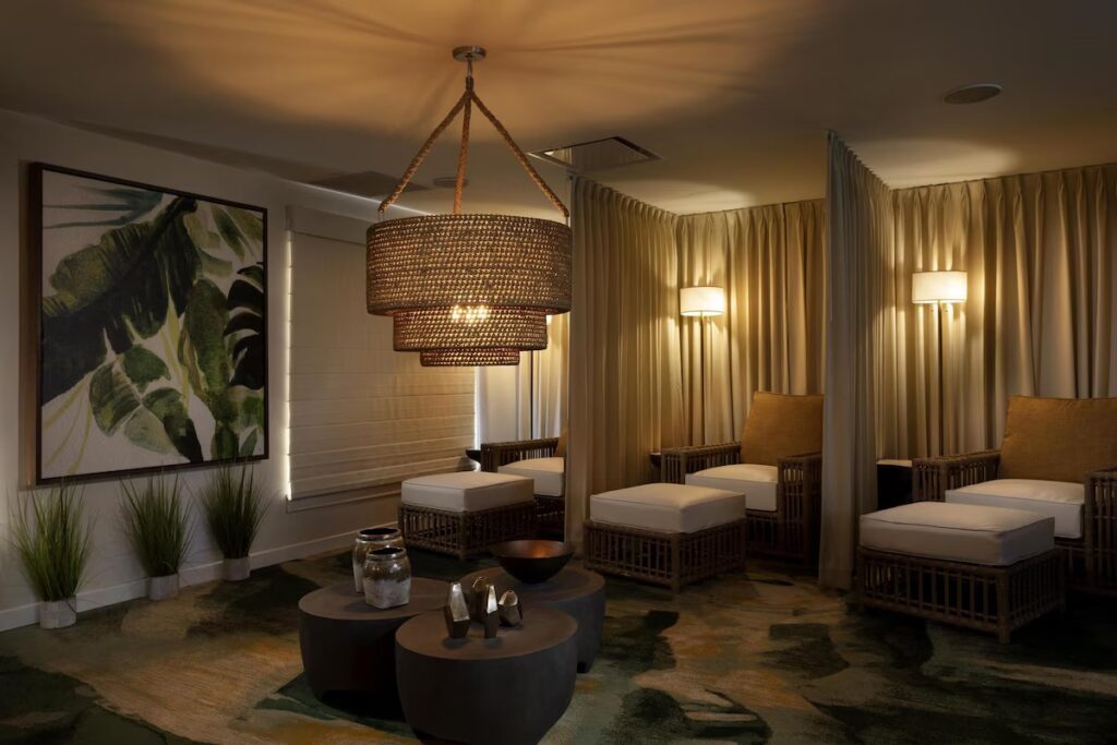 Cozy and dimly lit relaxation lounge with wicker chairs at the resort spa 