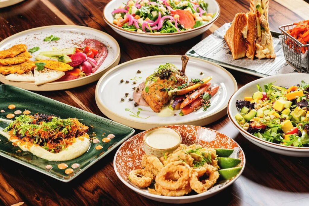 Table spread with delicious assorted resort dining dishes, meats, and salads 