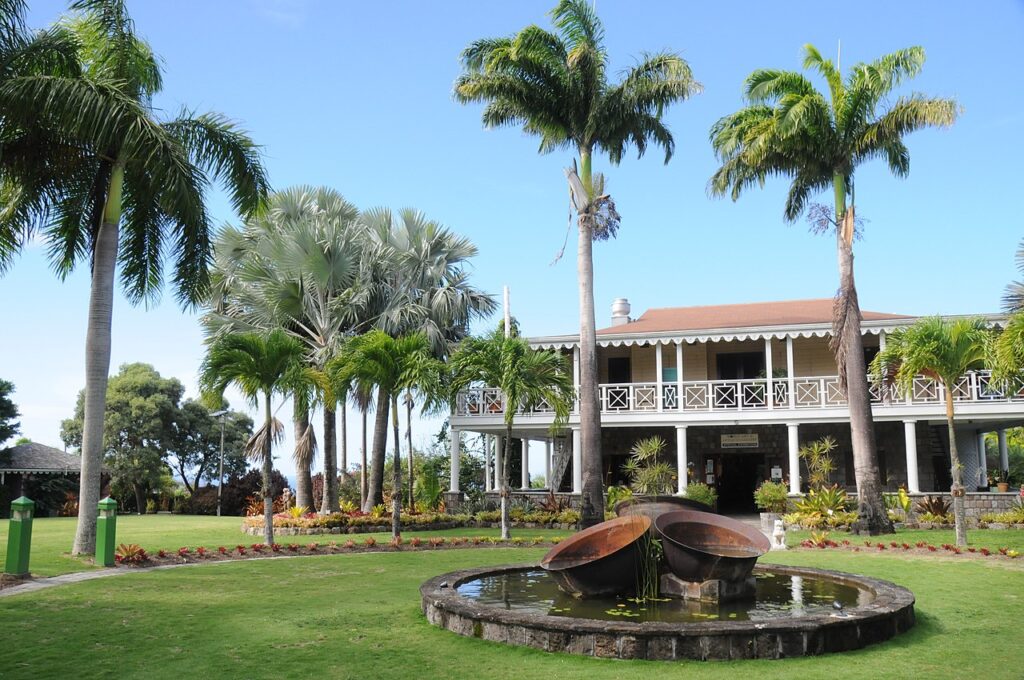 Lush greenery and fountains at Nevis Botanical Gardens, perfect for exploring on a caribbean vacation with kids