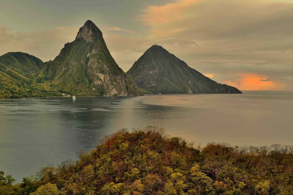 The iconic Pitons of St. Lucia at sunset, a must-see landmark on caribbean islands to visit 