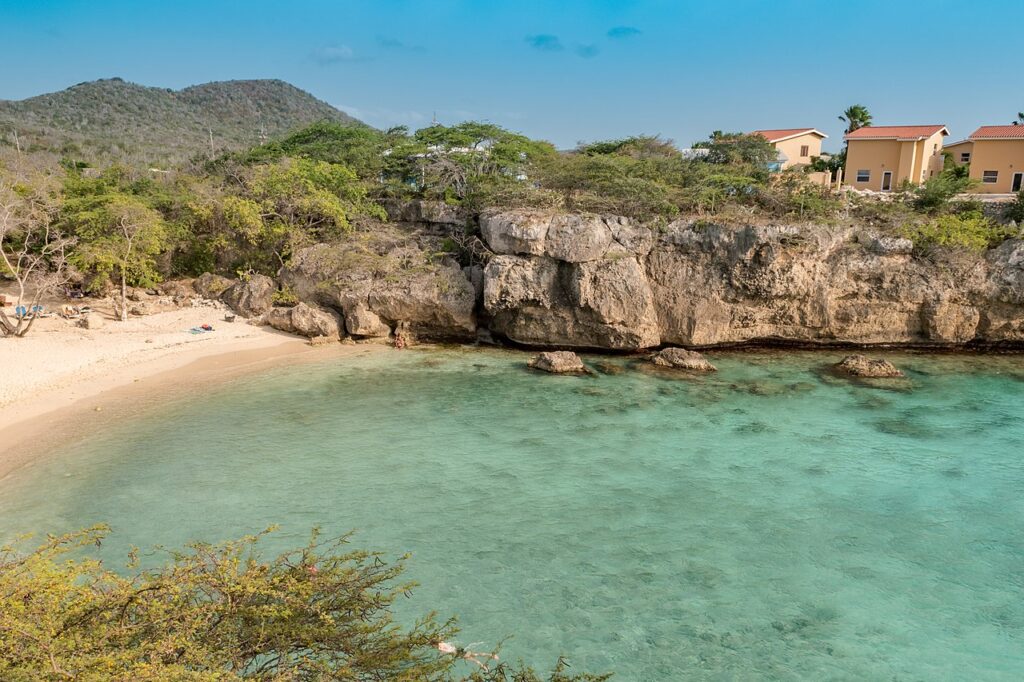 The secluded rocky cove of Playa Lagun in Curaçao, a hidden gem among cheap islands to visit
