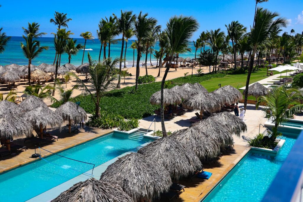 Overlooking tropical pools and umbrellas at one of the best caribbean resorts for families in Punta Cana