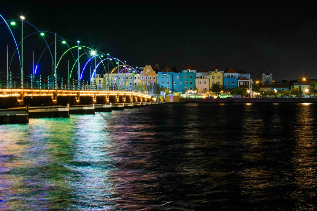 The lit-up Queen Emma Bridge in Curacao at night, highlighting the best caribbean islands to visit 