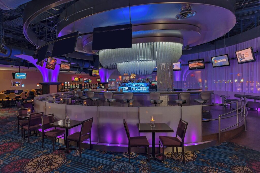 Vibrant, neon-lit circular bar inside the Sheraton Puerto Rico hotel casino 