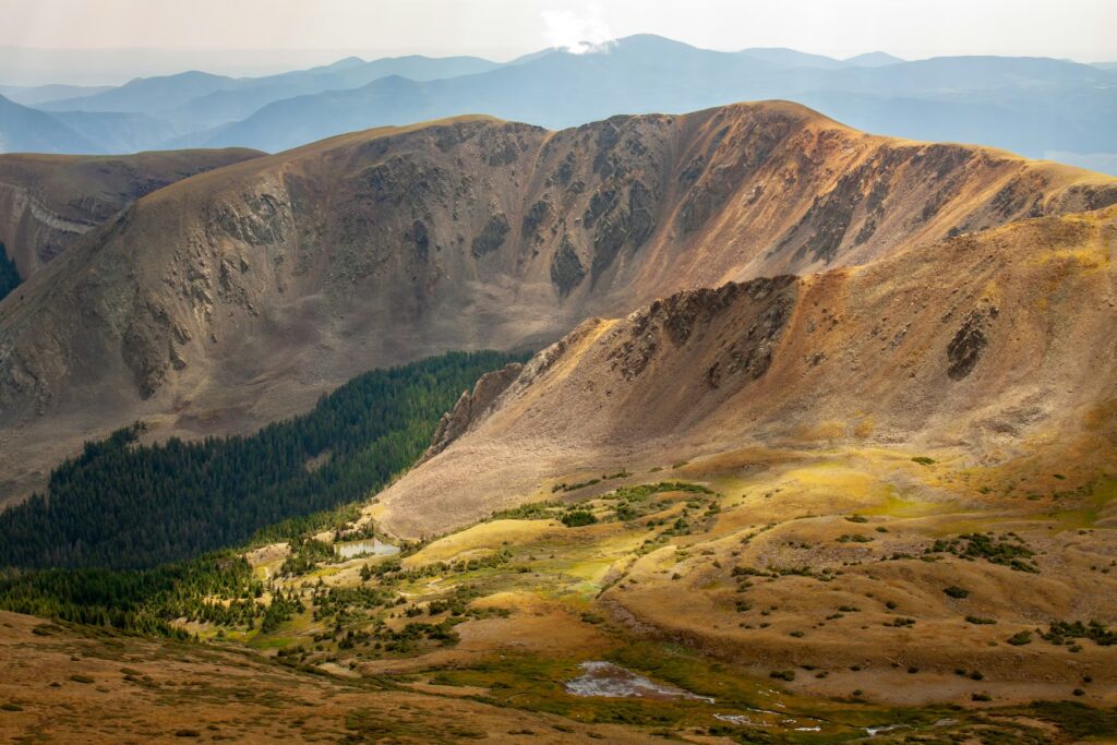 Sweeping views of the mountains and valleys in Taos, offering outdoor adventures for fun vacations for kids