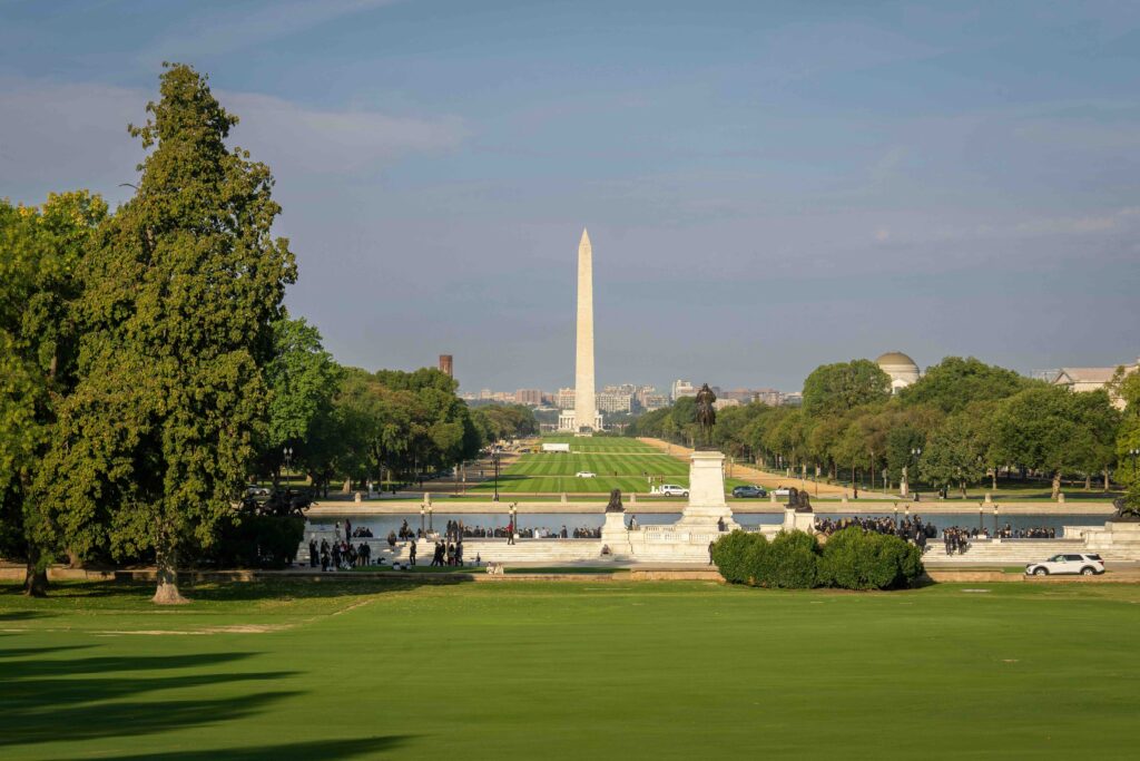 The Washington Monument seen from the grassy Mall, a historic stop for best family vacation spots