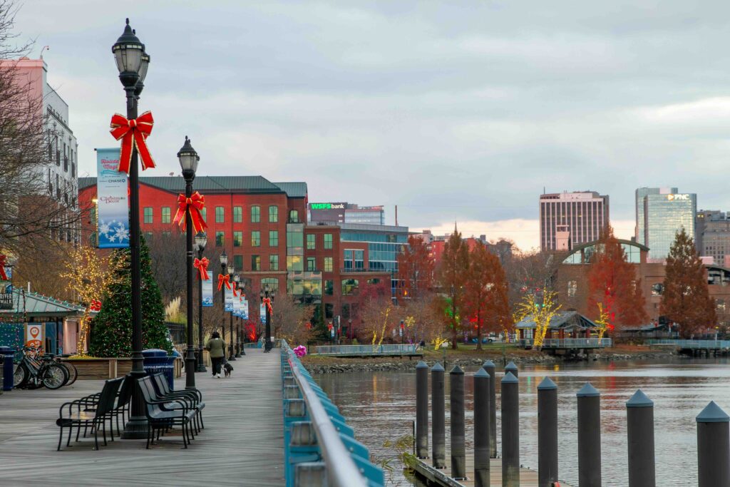 Festive holiday decorations along a Wilmington riverwalk, ideal for scenic kid-friendly activities