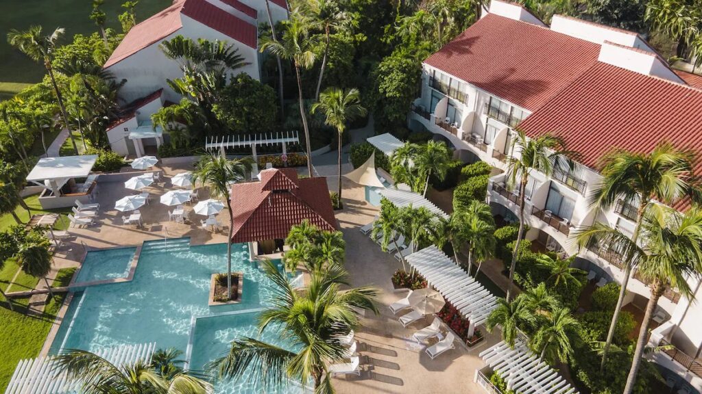 Aerial view of a pool at Wyndham Palmas, offering great puerto rico vacation packages 