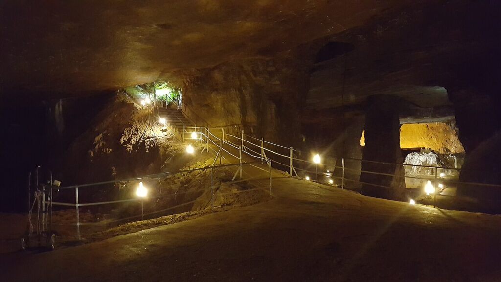 Illuminated walking paths and submerged sections of the underground Bonne Terre Mine in Missouri.