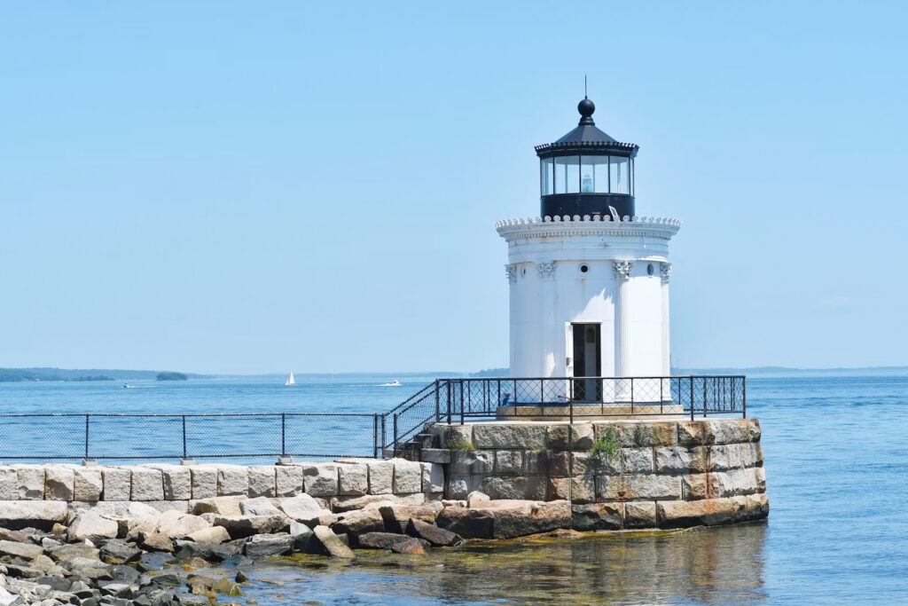 The small, ornamental Bug Light Breakwater Lighthouse modeled after a Greek Corinthian column. 