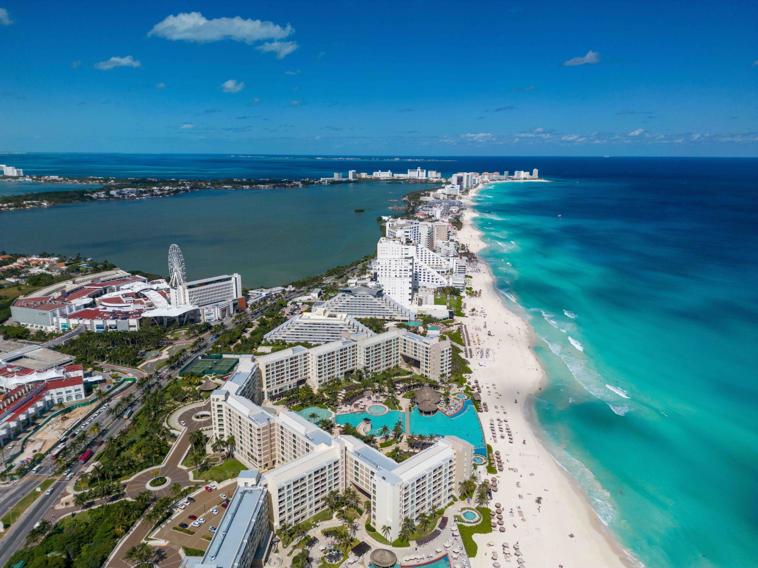 Aerial view of the beaches and resorts in Cancun's Hotel Zone, helping travelers decide the best time to visit Cancun. 