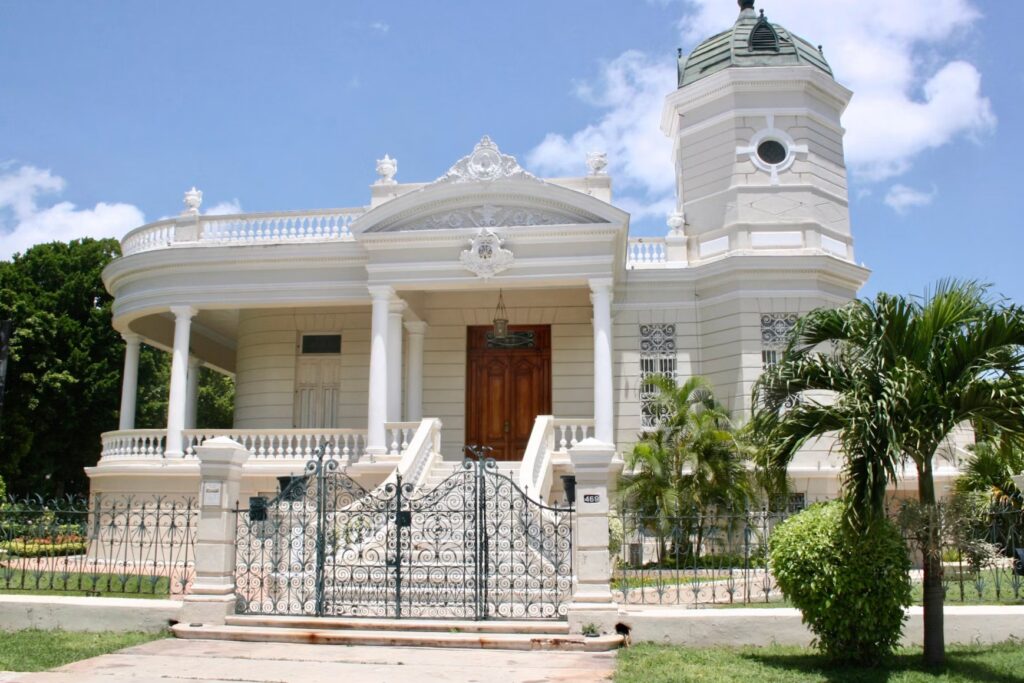 The stunning white architecture of Casa Museo Montes Molina in Mérida, showing why many ask, "is Merida Mexico safe?"