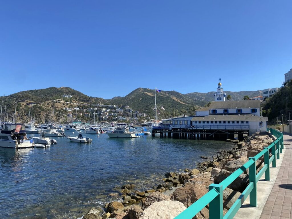 Boats anchored in the clear waters of the Avalon harbor at Catalina Island, California.