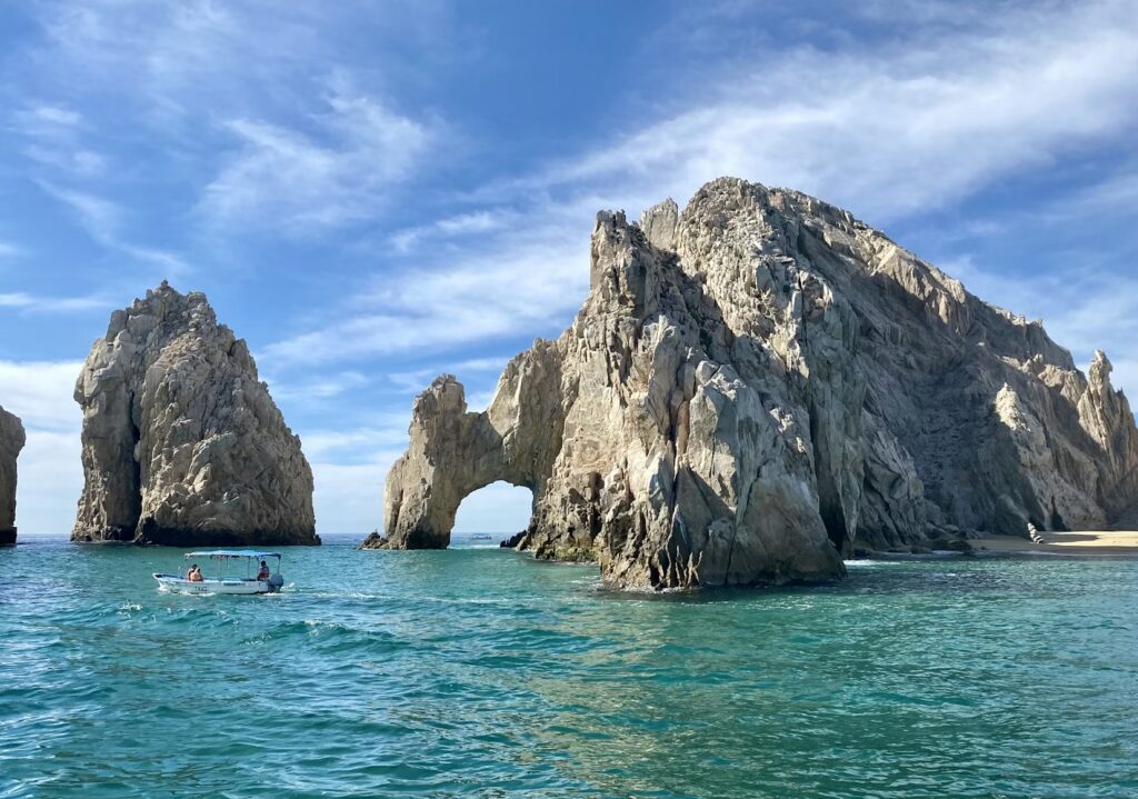 The iconic El Arco rock formation rising from the turquoise waters, answering "is Cabo San Lucas safe?"