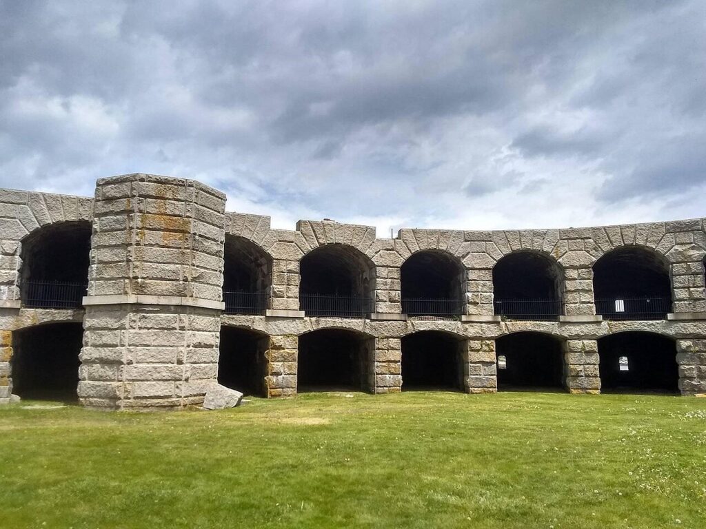 The historic, curved granite archways and structure of the Civil War-era Fort Popham ruins.