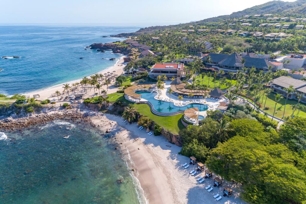Beautiful curved swimming pools and oceanfront lounging areas at Four Seasons Resort Punta Mita.