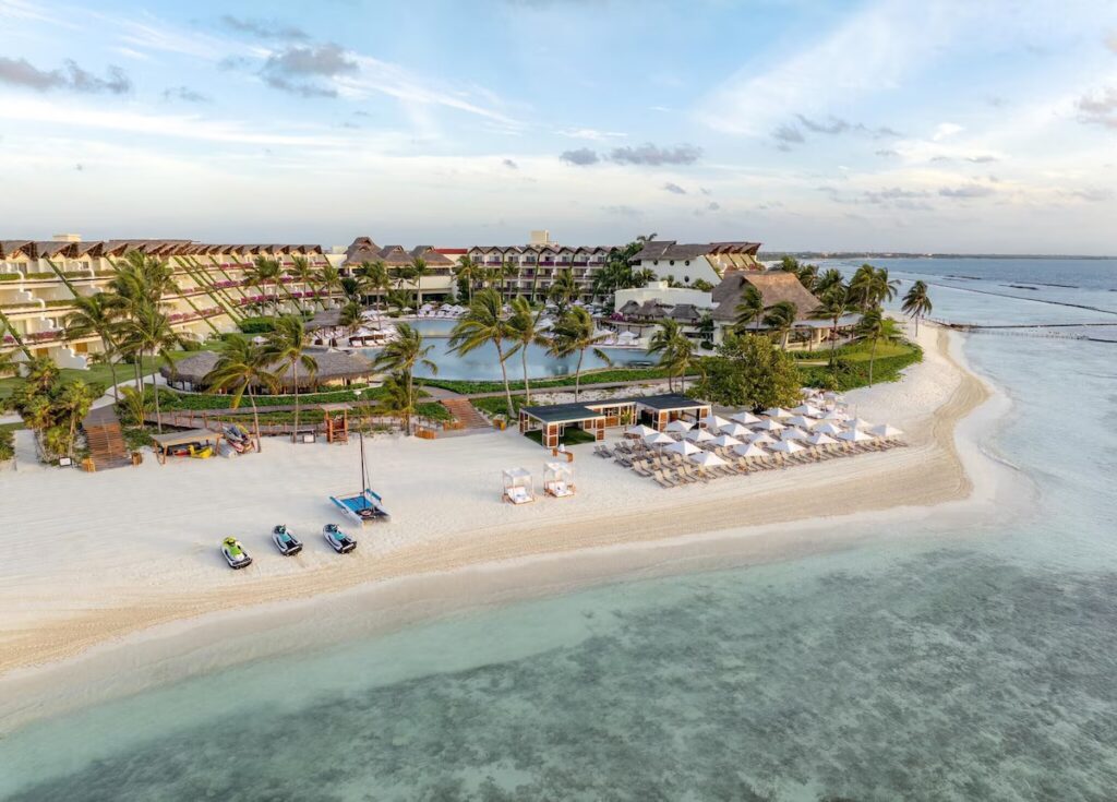 Aerial view of the white sand beach and jet skis at Grand Velas Riviera Maya. 