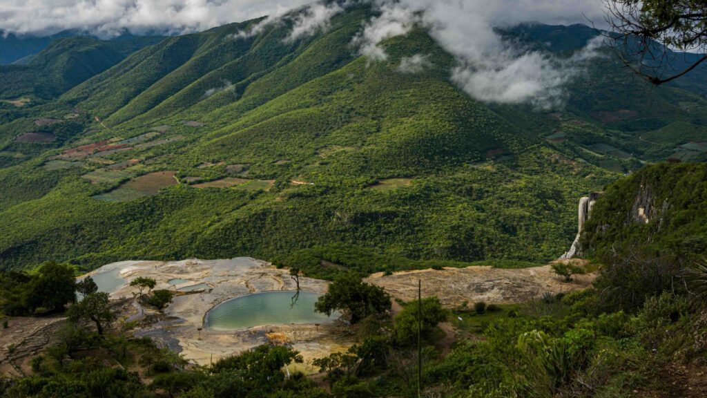 The breathtaking, petrified rock waterfalls of Hierve el Agua overlooking the lush mountain valleys near Oaxaca City.