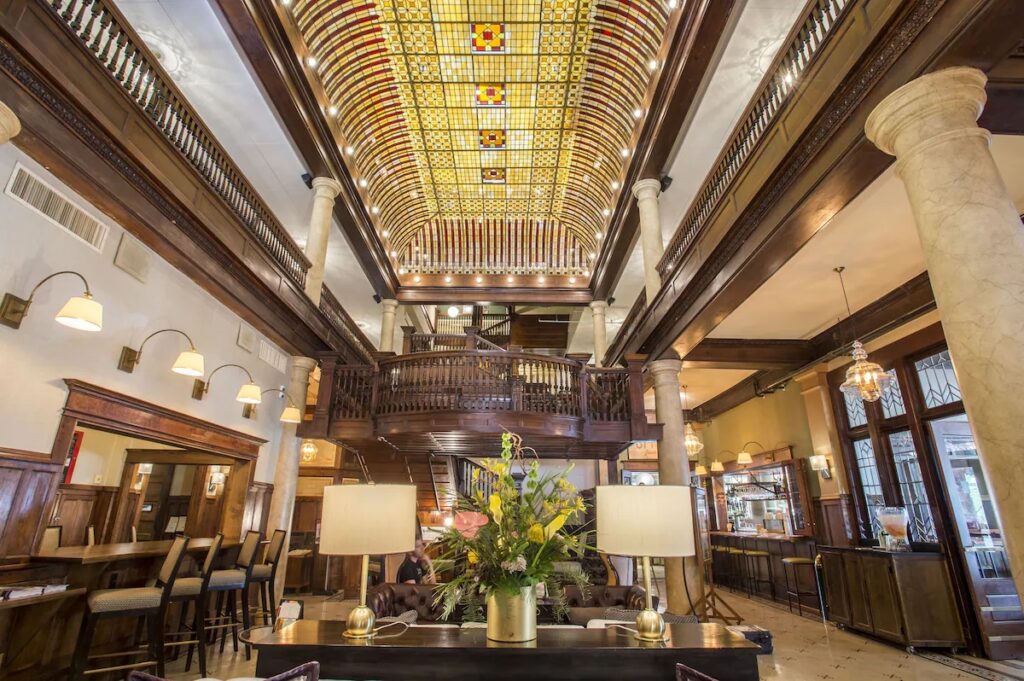 Historic lobby featuring a stained-glass ceiling at Hotel Boulderado in Boulder. 